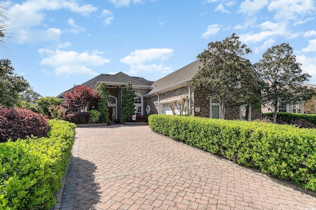 276 Waterfall Cir, Little River, SC 29566 - view of front of home featuring decorative driveway, a garage, and brick siding