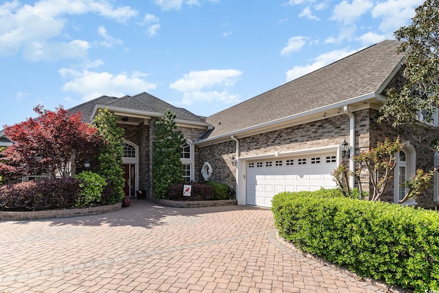 276 Waterfall Cir, Little River, SC 29566 - view of front facade featuring decorative driveway, a shingled roof, and an attached garage