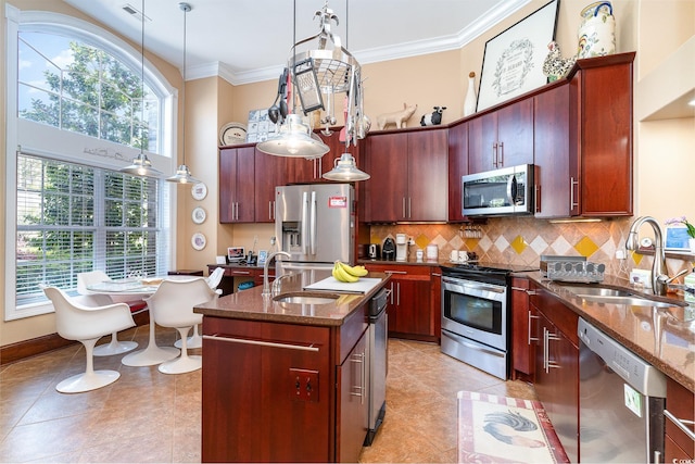 276 Waterfall Cir, Little River, SC 29566 - kitchen featuring dark stone counters, a sink, appliances with stainless steel finishes, and visible vents