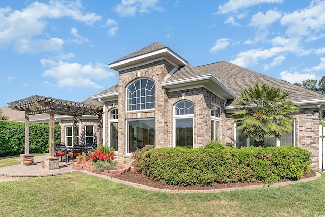 276 Waterfall Cir, Little River, SC 29566 - back of house featuring brick siding, a yard, and a pergola