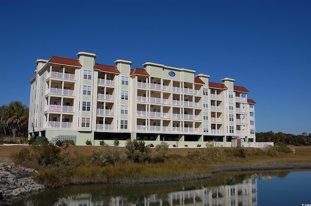 view of building exterior featuring a water view