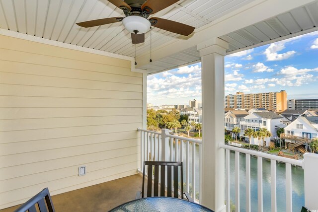 502 48th Ave S Unit 402, North Myrtle Beach, SC 29582 - balcony featuring a water view and ceiling fan