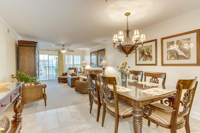 dining area with crown molding, visible vents, ceiling fan with notable chandelier, and light colored carpet