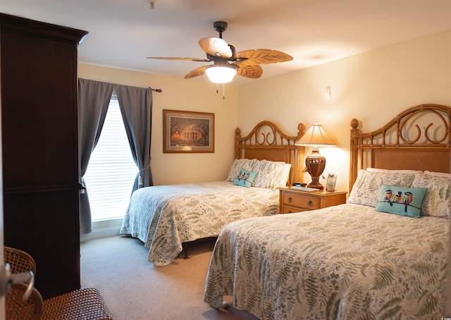 carpeted bedroom featuring a ceiling fan