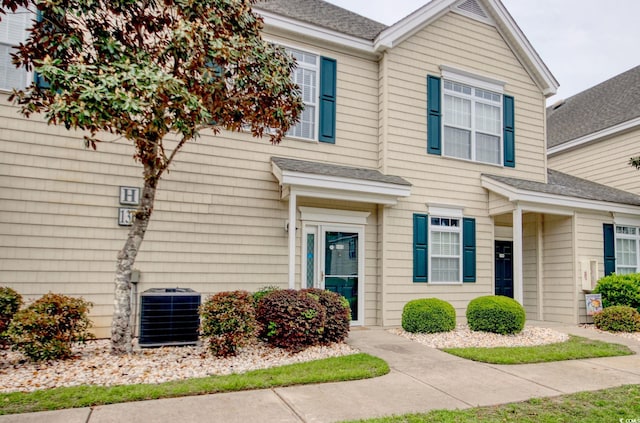 130 Scotch Broom Dr Unit H-103, Little River, SC 29566 - view of front of home featuring a shingled roof and central AC unit