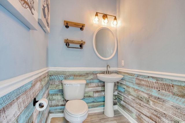 130 Scotch Broom Dr Unit H-103, Little River, SC 29566 - half bath with tile walls, wainscoting, toilet, and a sink