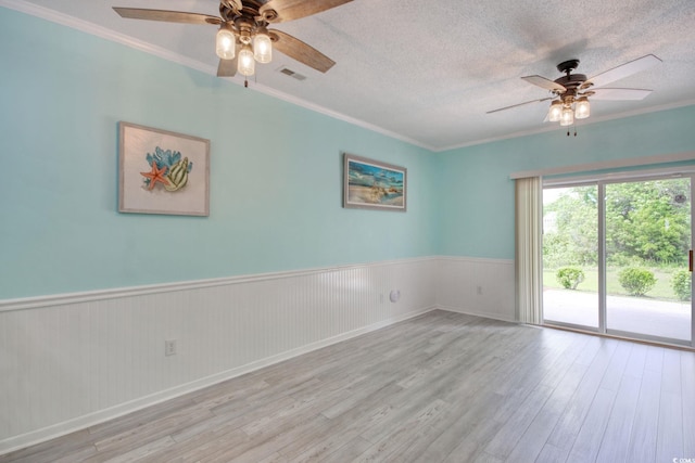 130 Scotch Broom Dr Unit H-103, Little River, SC 29566 - spare room with ornamental molding, a wainscoted wall, ceiling fan, and wood finished floors