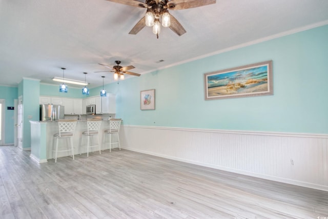 130 Scotch Broom Dr Unit H-103, Little River, SC 29566 - kitchen with appliances with stainless steel finishes, open floor plan, a peninsula, and a ceiling fan