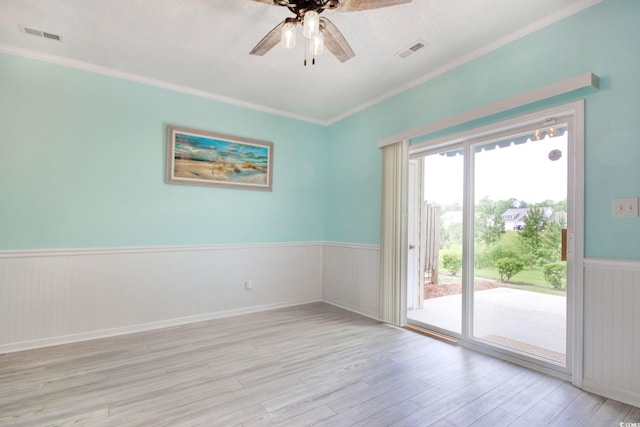 130 Scotch Broom Dr Unit H-103, Little River, SC 29566 - unfurnished room with light wood-style floors, a ceiling fan, visible vents, ornamental molding, and wainscoting