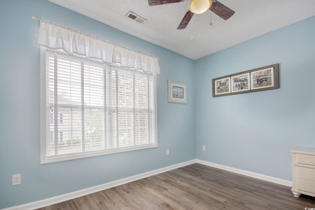 130 Scotch Broom Dr Unit H-103, Little River, SC 29566 - unfurnished room with visible vents, ceiling fan, wood finished floors, and a healthy amount of sunlight