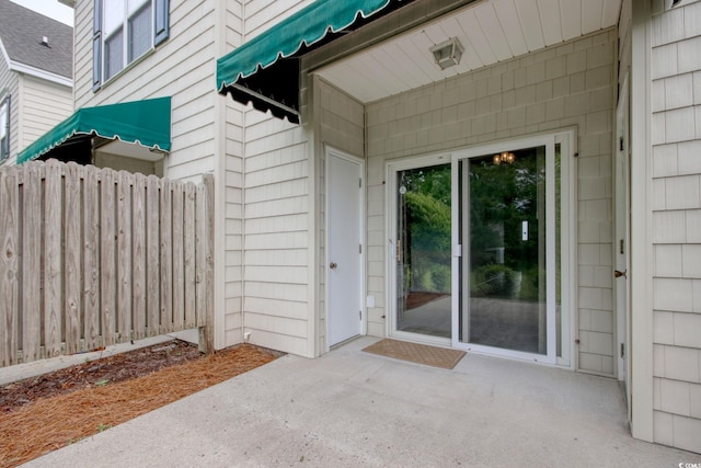 130 Scotch Broom Dr Unit H-103, Little River, SC 29566 - view of exterior entry with fence and a patio area