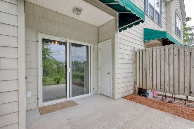 130 Scotch Broom Dr Unit H-103, Little River, SC 29566 - doorway to property with a patio and fence