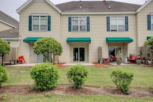 130 Scotch Broom Dr Unit H-103, Little River, SC 29566 - rear view of property featuring a lawn, a patio, and roof with shingles