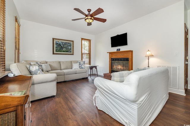 221 Lander Dr, Conway, SC 29526 - living area with a ceiling fan, dark wood-style floors, a glass covered fireplace, and baseboards