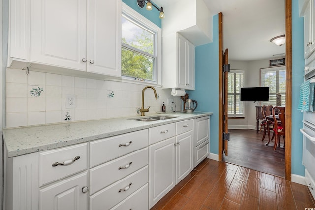 221 Lander Dr, Conway, SC 29526 - kitchen with a sink, tasteful backsplash, white cabinets, baseboards, and dark wood finished floors