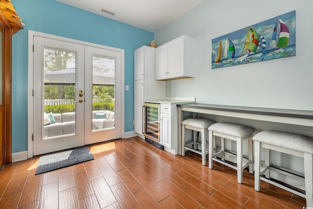 221 Lander Dr, Conway, SC 29526 - entryway featuring wine cooler, french doors, dark wood finished floors, and baseboards