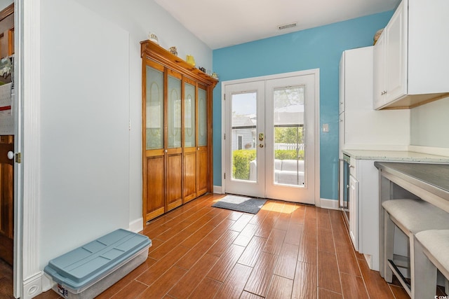 221 Lander Dr, Conway, SC 29526 - doorway to outside featuring french doors, wood finished floors, and baseboards