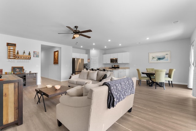 109 River Vista Way, Myrtle Beach, SC 29588 - living room featuring a ceiling fan, recessed lighting, baseboards, and light wood-style flooring