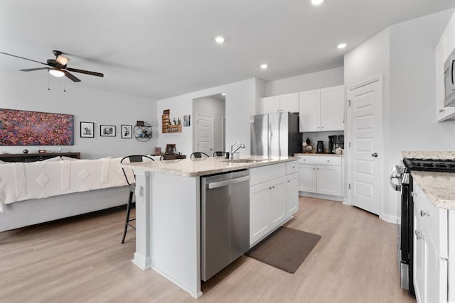 109 River Vista Way, Myrtle Beach, SC 29588 - kitchen featuring appliances with stainless steel finishes, a sink, ceiling fan, light wood-type flooring, and recessed lighting