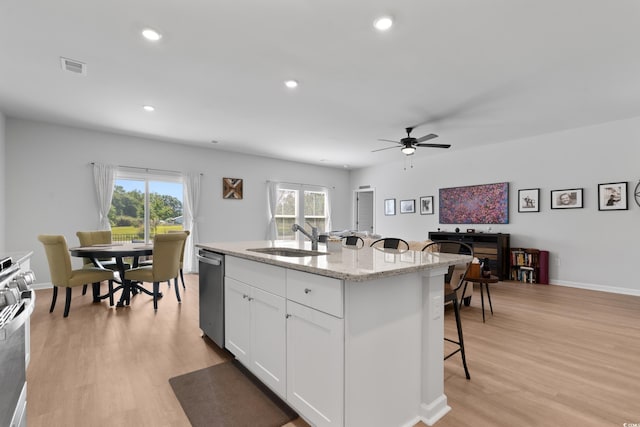 109 River Vista Way, Myrtle Beach, SC 29588 - kitchen featuring stainless steel appliances, a sink, a kitchen breakfast bar, white cabinetry, and a kitchen island with sink
