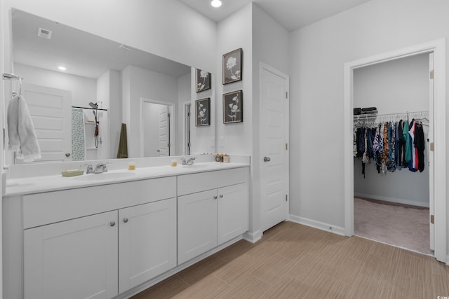 109 River Vista Way, Myrtle Beach, SC 29588 - full bathroom with double vanity, a spacious closet, baseboards, and recessed lighting