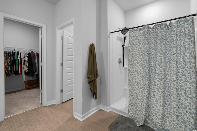109 River Vista Way, Myrtle Beach, SC 29588 - bathroom featuring a stall shower, a spacious closet, and baseboards