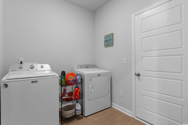 109 River Vista Way, Myrtle Beach, SC 29588 - washroom with washer and clothes dryer, light wood-type flooring, and baseboards