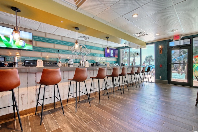 7200 Ocean Blvd N Unit 664, Myrtle Beach, SC 29572 - bar area featuring wood finished floors and pendant lighting
