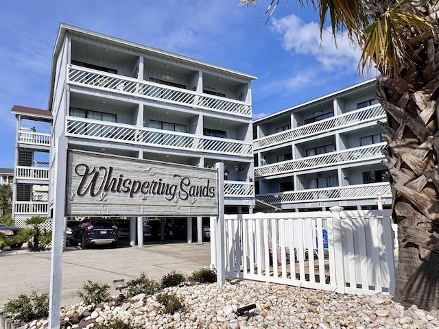 view of building exterior featuring fence