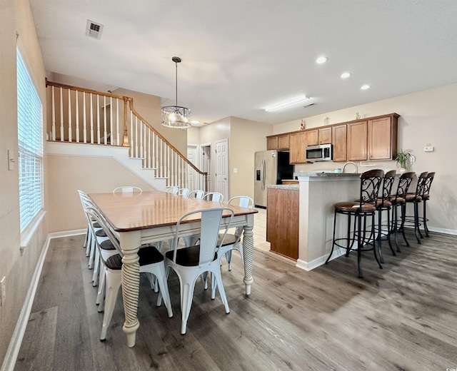 living room featuring light wood finished floors and a ceiling fan
