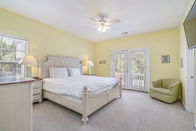 bedroom with connected bathroom, a sink, baseboards, ceiling fan, and light colored carpet