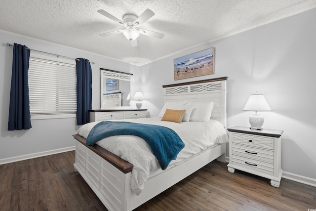 bedroom featuring crown molding, baseboards, a textured ceiling, and wood finished floors