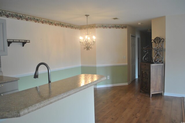 22 Woodhaven Dr Unit C, Murrells Inlet, SC 29576 - kitchen with dark wood-style floors, baseboards, decorative light fixtures, and a chandelier