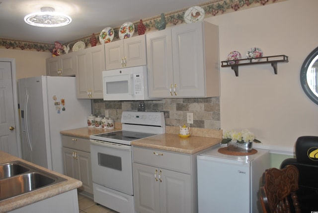22 Woodhaven Dr Unit C, Murrells Inlet, SC 29576 - kitchen with white appliances, open shelves, decorative backsplash, and light countertops