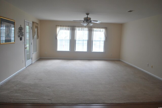 22 Woodhaven Dr Unit C, Murrells Inlet, SC 29576 - empty room featuring carpet floors, baseboards, and ceiling fan
