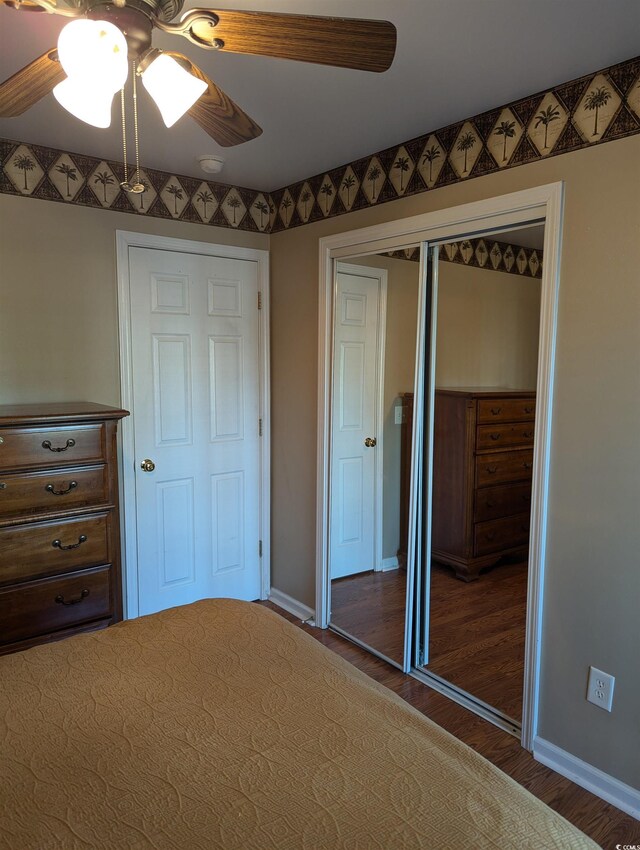 22 Woodhaven Dr Unit C, Murrells Inlet, SC 29576 - unfurnished bedroom featuring a closet, wood finished floors, baseboards, and a ceiling fan