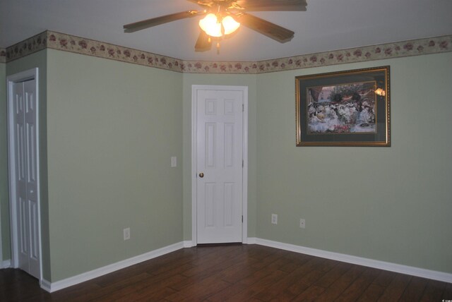 22 Woodhaven Dr Unit C, Murrells Inlet, SC 29576 - unfurnished room featuring dark wood-type flooring, ceiling fan, and baseboards
