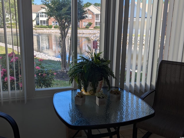 22 Woodhaven Dr Unit C, Murrells Inlet, SC 29576 - dining room featuring a water view and tile patterned floors