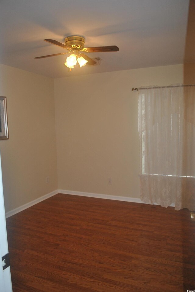 22 Woodhaven Dr Unit C, Murrells Inlet, SC 29576 - unfurnished room with wood finished floors, a ceiling fan, and baseboards