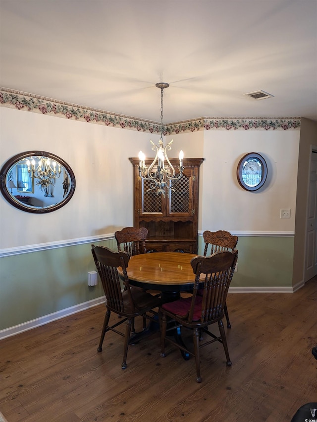 22 Woodhaven Dr Unit C, Murrells Inlet, SC 29576 - dining area with baseboards, a notable chandelier, wood finished floors, and visible vents