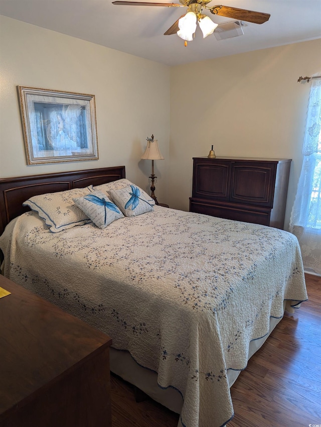 22 Woodhaven Dr Unit C, Murrells Inlet, SC 29576 - bedroom featuring a ceiling fan and dark wood finished floors