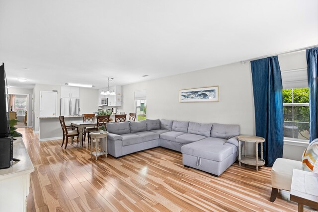 1204 River Oak Dr Unit 25-A, Myrtle Beach, SC 29579 - living area with light wood-style floors, a chandelier, and healthy amount of natural light