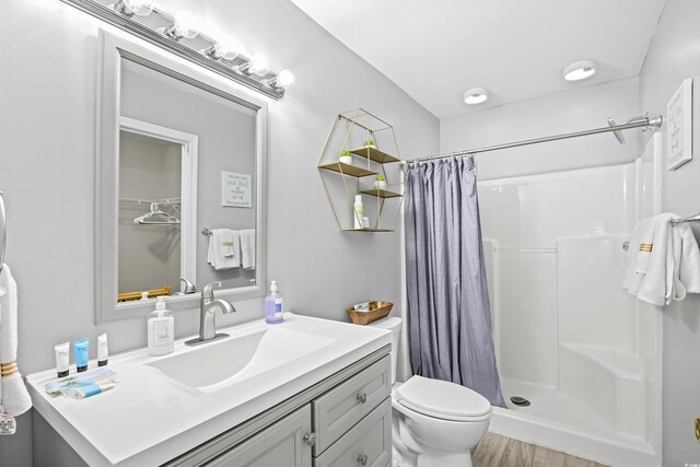 1204 River Oak Dr Unit 25-A, Myrtle Beach, SC 29579 - full bath with a shower stall, toilet, wood finished floors, and vanity