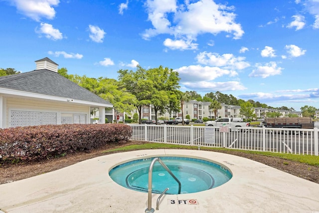1204 River Oak Dr Unit 25-A, Myrtle Beach, SC 29579 - view of pool featuring fence, a hot tub, and a residential view