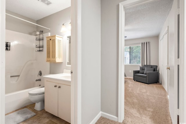 full bathroom featuring toilet, shower / bathing tub combination, vanity, visible vents, and a textured ceiling