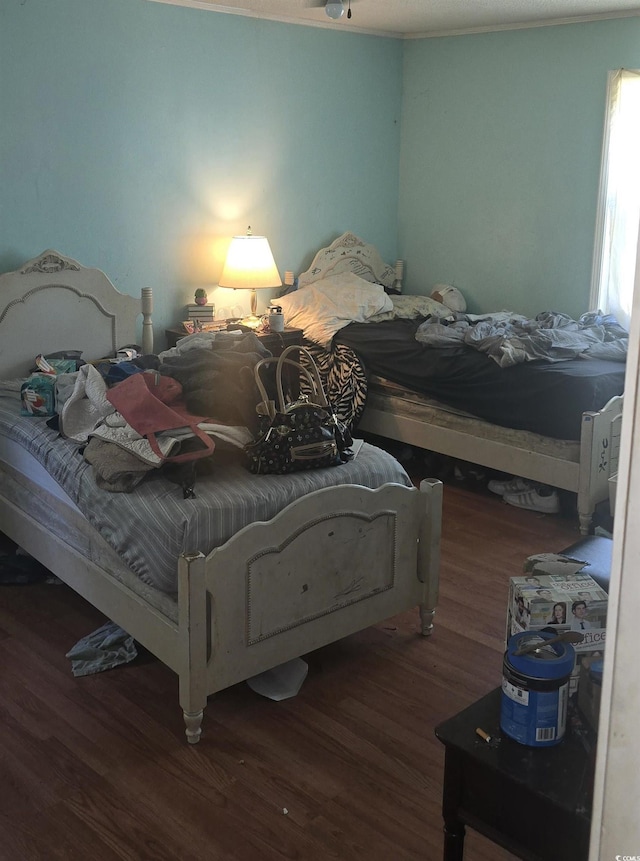 bedroom featuring wood finished floors
