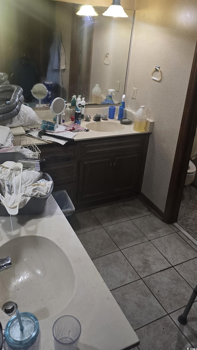 bathroom with tile patterned floors and vanity