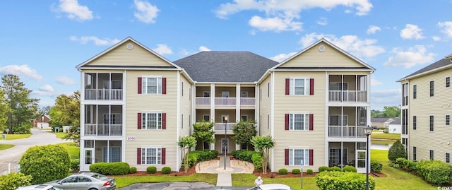 2090 Cross Gate Blvd Unit 202, Surfside Beach, SC 29575 - view of building exterior featuring uncovered parking