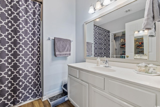 2090 Cross Gate Blvd Unit 202, Surfside Beach, SC 29575 - full bath with vanity, wood finished floors, and a shower with shower curtain