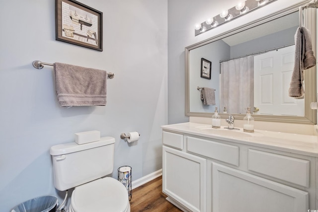 2090 Cross Gate Blvd Unit 202, Surfside Beach, SC 29575 - bathroom featuring toilet, baseboards, vanity, and wood finished floors